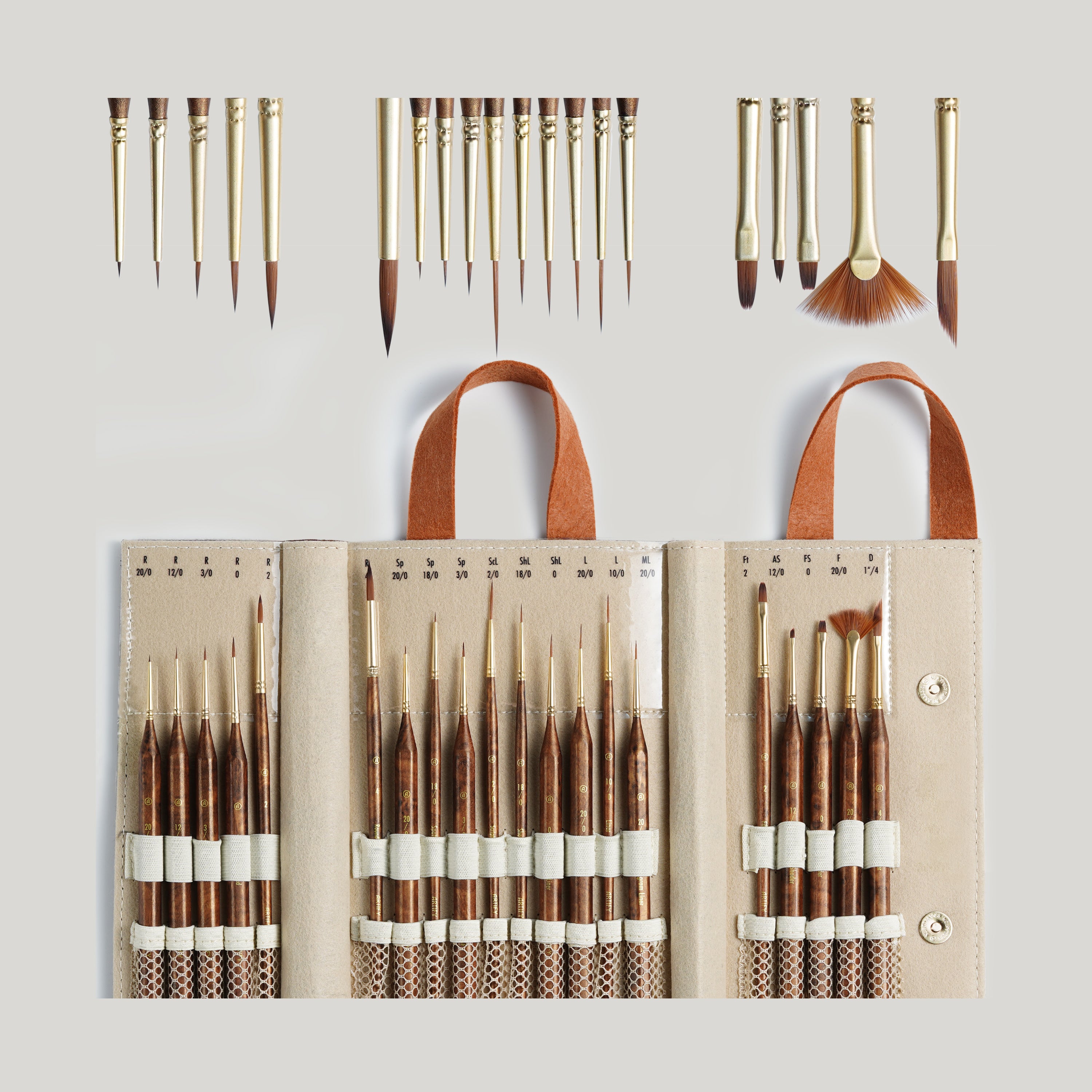A collection of paint brushes with wooden handles and synthetic bristles, displayed in various sizes and shapes, accompanied by a leather-look carrying case.