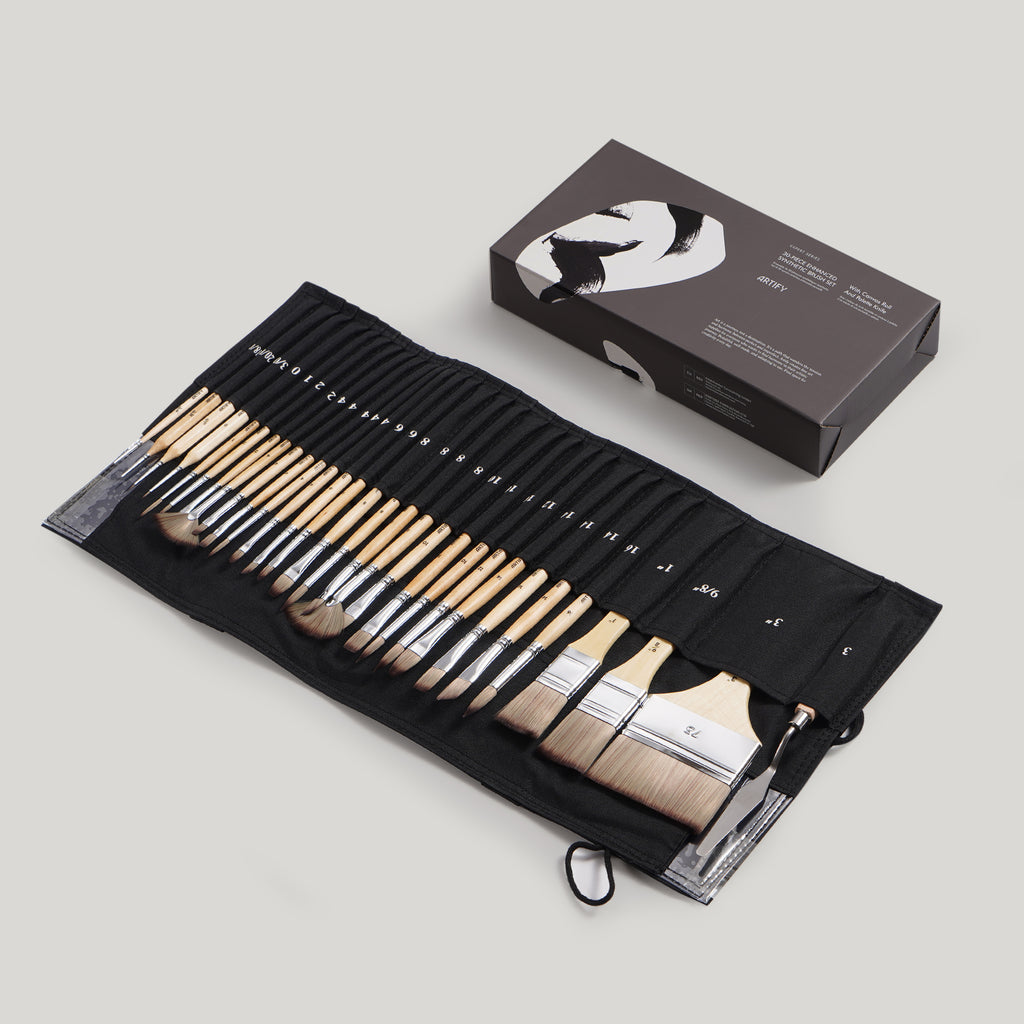 A 30-piece expert paint brush set displayed in a black nylon cloth roll with various brush types including liner, flat, angular, filbert, round, fan, and comb, alongside a canvas roll and palette knife. The set appears to be of high quality with bristles visible and securely attached to the handles.